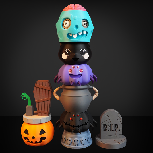 Stacked toy figures with a brain on a skull, surrounded by Halloween-themed items like a pumpkin and tombstone.
